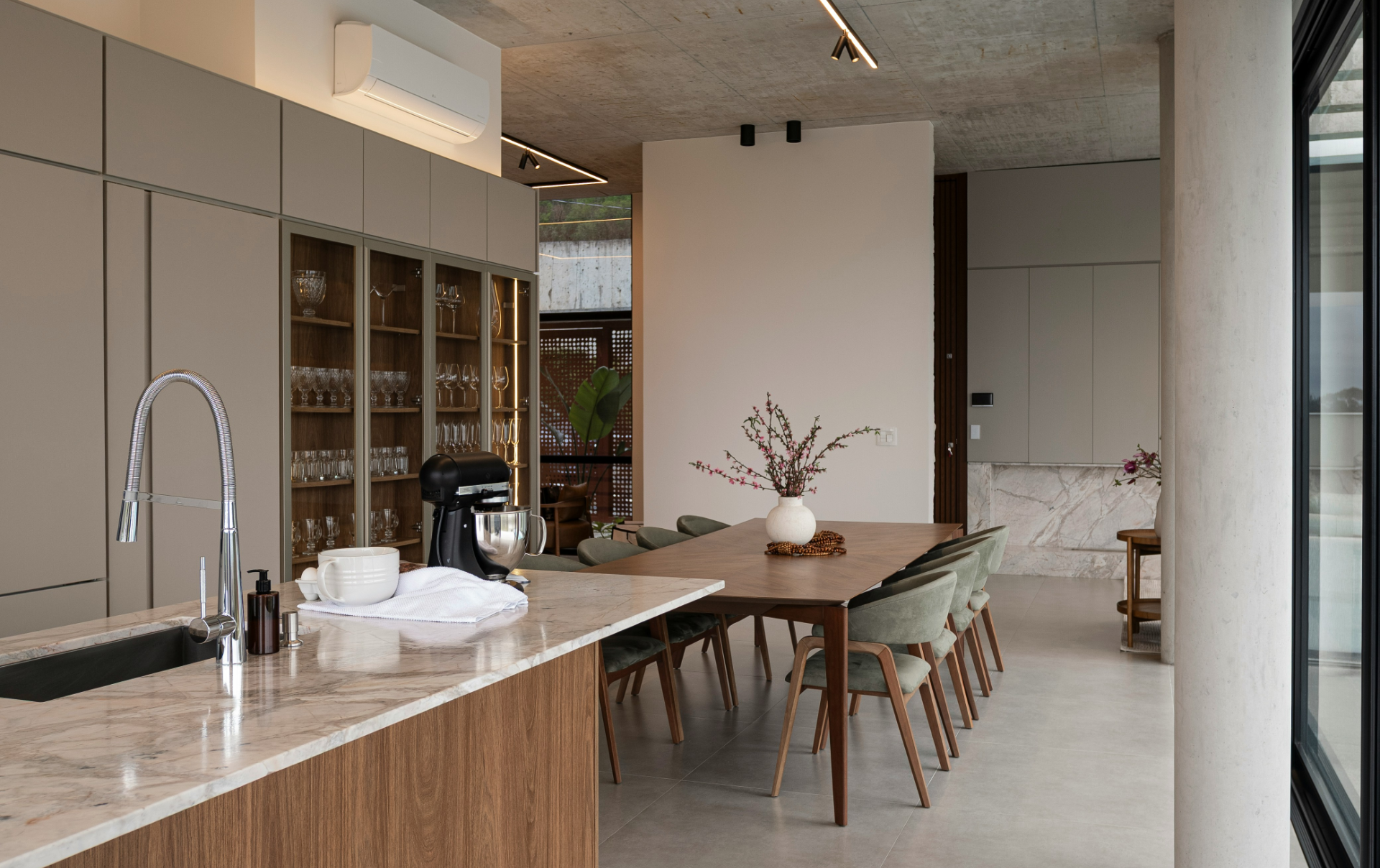 Modern minimalist kitchen design with warm neutral tones and premium finishes by Amé Studio